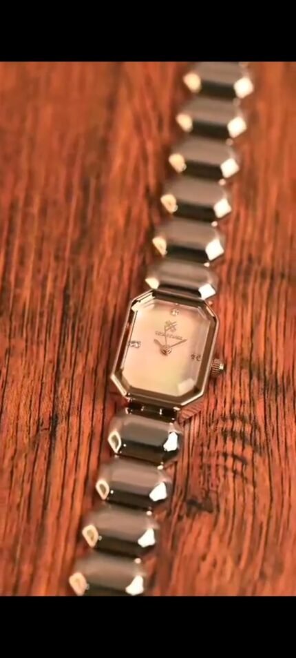 This gives it a soft, iridescent glow with hints of white, pink, and other very light tones depending on the light.