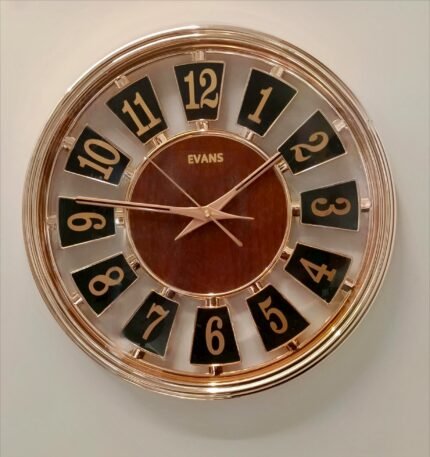 Evans Luxury Rose Gold & Wood Finish Floating Numeral Wall ClockElevate your home decor with this stunning wall clock from Evans. "
